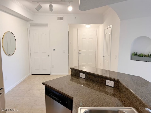 kitchen with ornamental molding, stainless steel dishwasher, and light tile patterned flooring