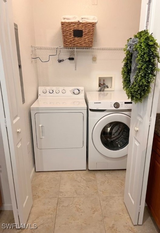 laundry room featuring washing machine and clothes dryer