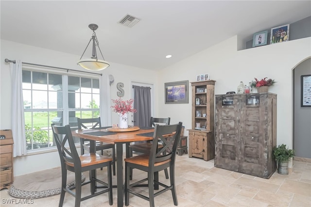 dining room with vaulted ceiling