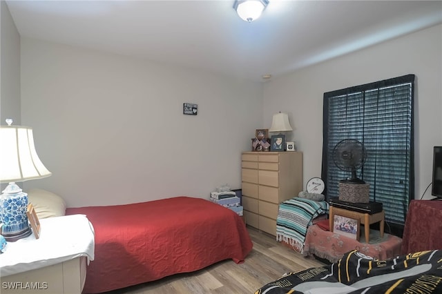 bedroom with light wood-type flooring