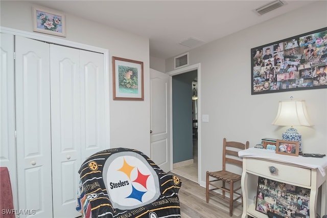 playroom with light hardwood / wood-style flooring