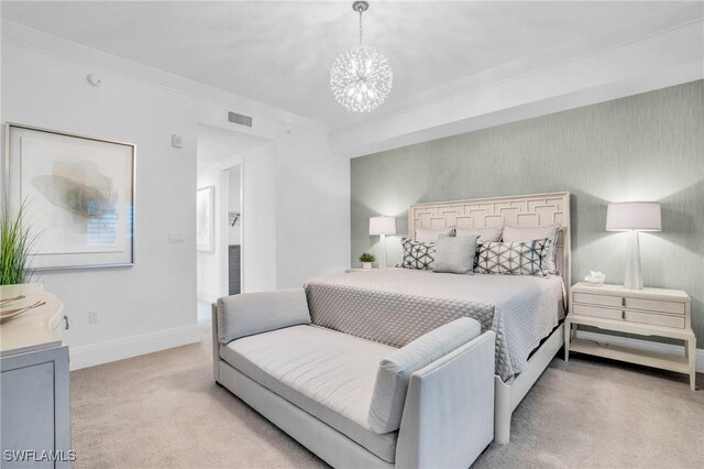 carpeted bedroom featuring a notable chandelier