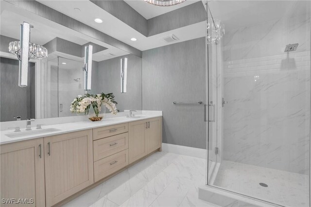 bathroom featuring tile patterned floors, dual vanity, and an enclosed shower