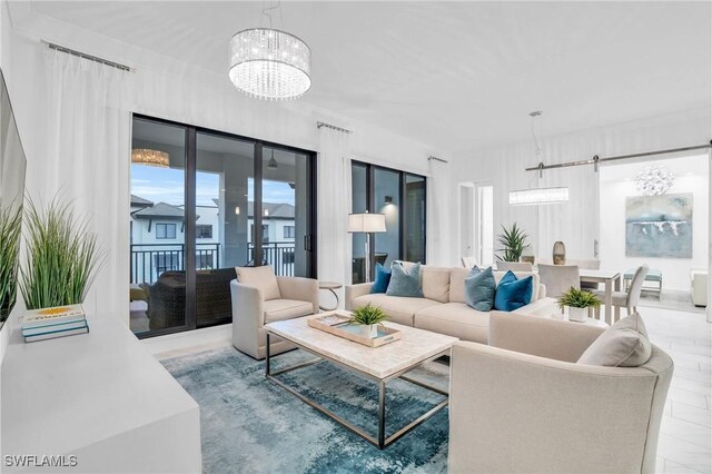 living room featuring a notable chandelier