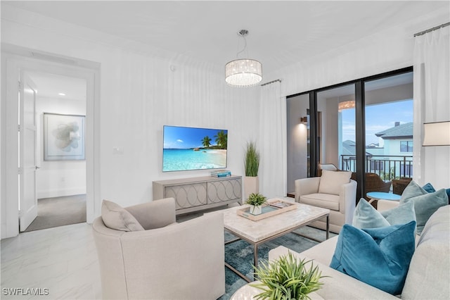 living room with tile patterned flooring and a chandelier