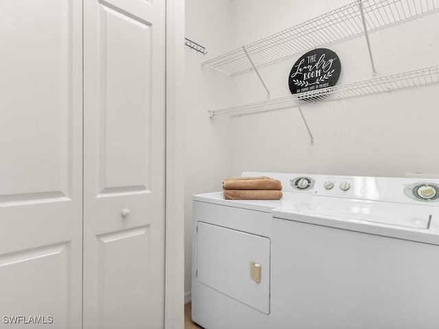 laundry area with independent washer and dryer