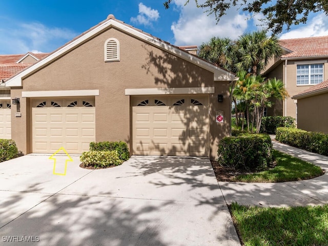 20141 Seagrove St Unit 308, Estero, FL 33928 - townhome / multi-family property with stucco siding and driveway