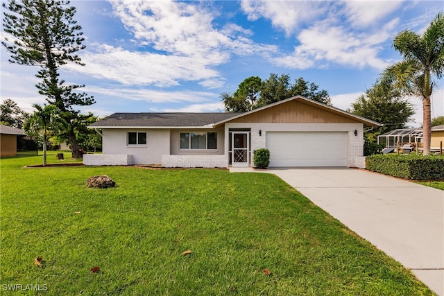 ranch-style house with a garage and a front lawn