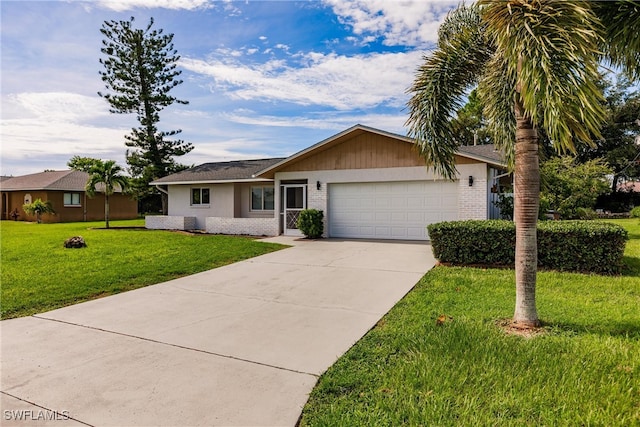 single story home with a garage and a front lawn