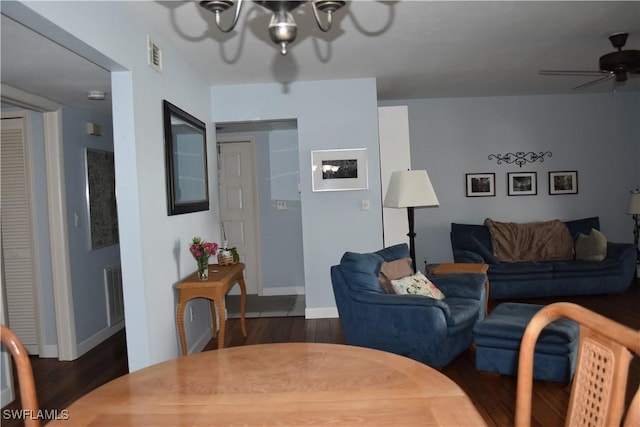 7125 Lakeridge Ct Unit 118, Fort Myers, FL 33907 - living area featuring a chandelier, dark wood-style flooring, baseboards, and a ceiling fan