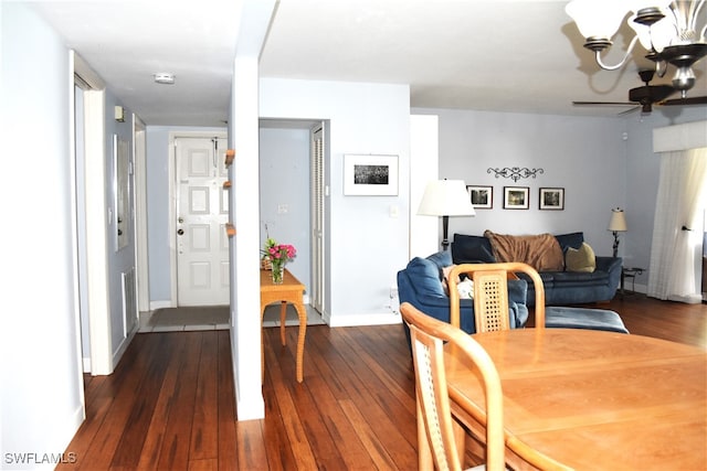 dining area featuring ceiling fan and dark hardwood / wood-style flooring