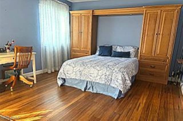 bedroom featuring hardwood / wood-style flooring