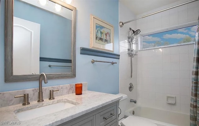 full bathroom featuring shower / bath combination with curtain and vanity