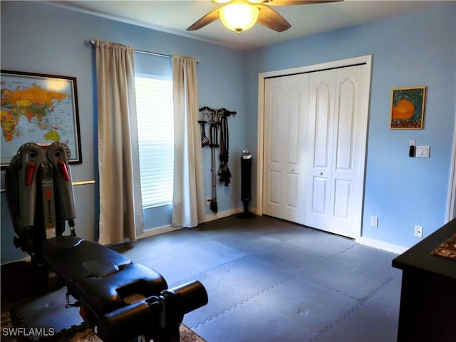 interior space featuring a ceiling fan and baseboards