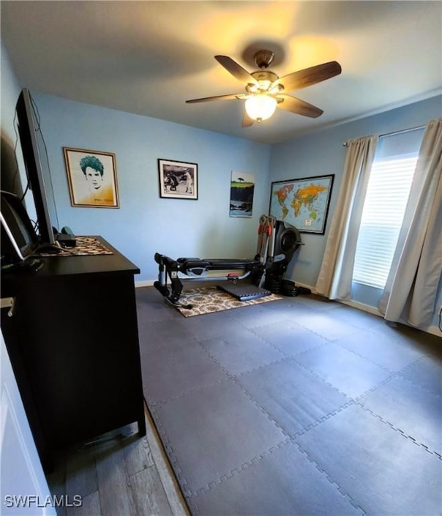 workout room featuring ceiling fan