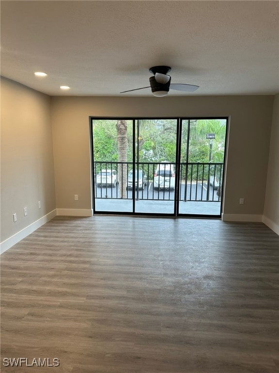 spare room featuring ceiling fan and wood-type flooring