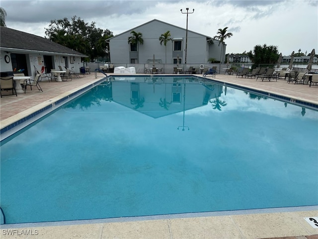 view of swimming pool with a patio