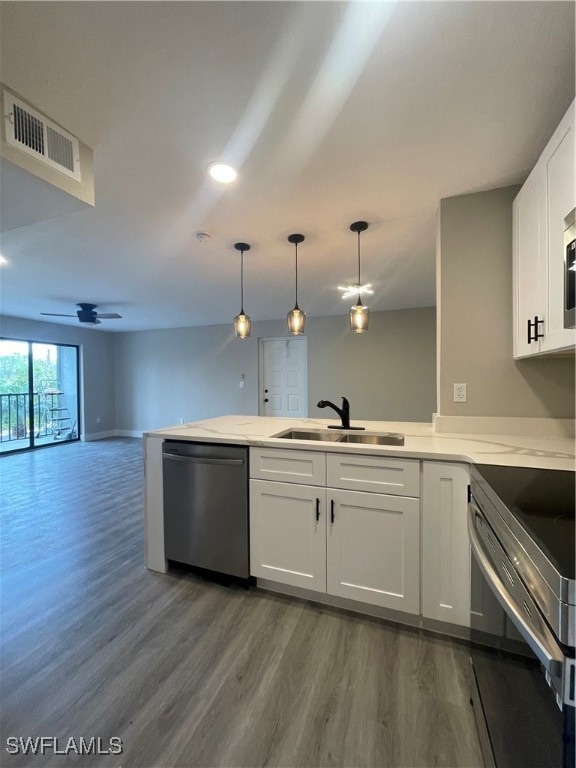 kitchen with stainless steel dishwasher, wood-type flooring, ceiling fan, range, and sink