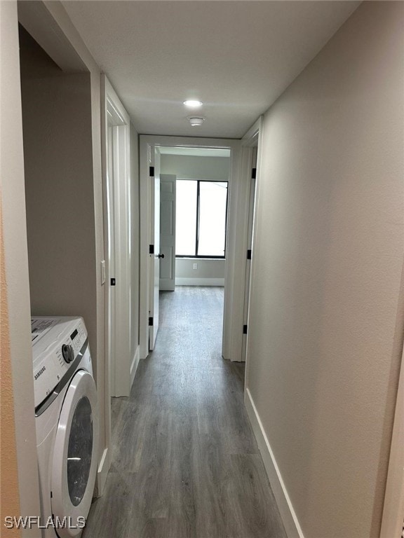 interior space featuring washer / clothes dryer and hardwood / wood-style floors