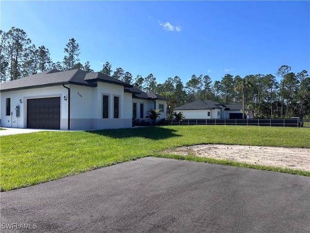 exterior space featuring a front yard and a garage