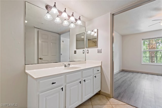 bathroom featuring vanity, tile patterned flooring, and ceiling fan