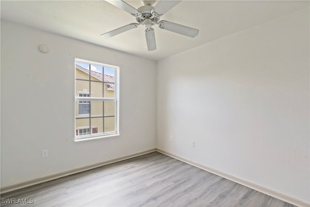 empty room with light hardwood / wood-style floors and ceiling fan