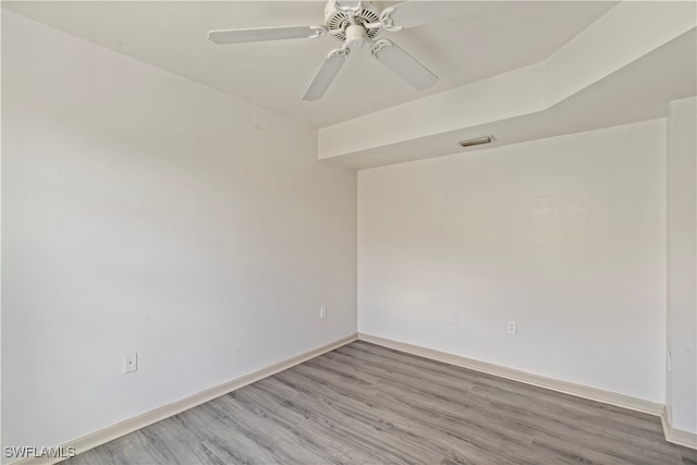 unfurnished room featuring hardwood / wood-style floors and ceiling fan