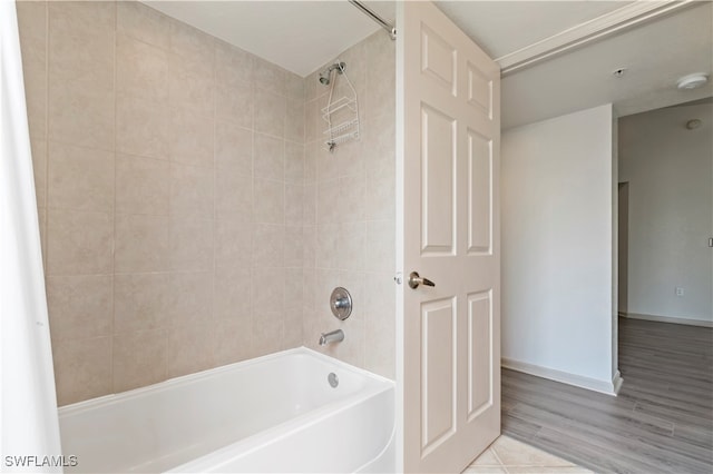 bathroom featuring shower / bath combo and hardwood / wood-style floors