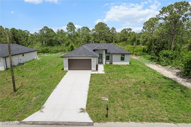 view of front facade with a garage and a front yard