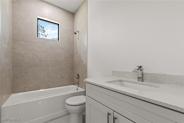 full bathroom featuring tiled shower / bath combo, toilet, and vanity