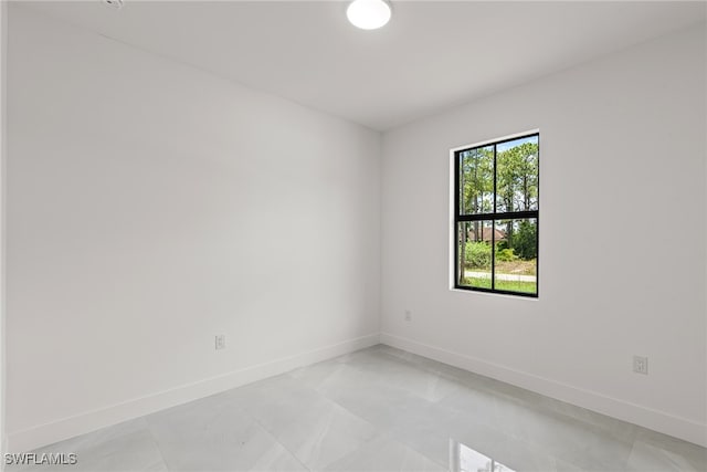 unfurnished room with light tile patterned floors