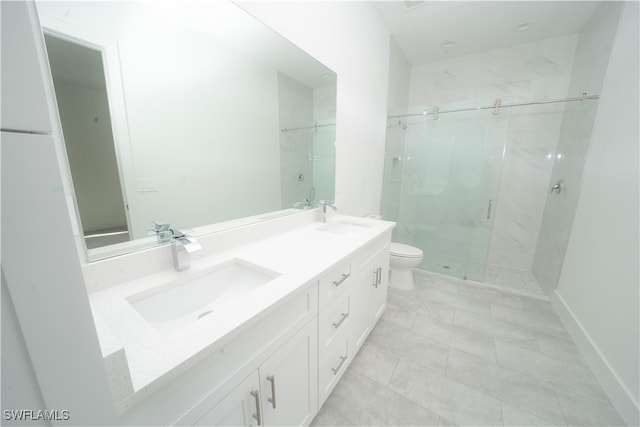 bathroom with vanity, an enclosed shower, and toilet