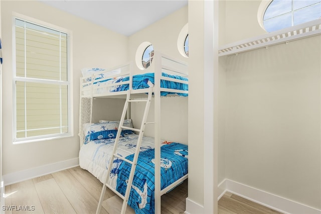 bedroom with wood-type flooring