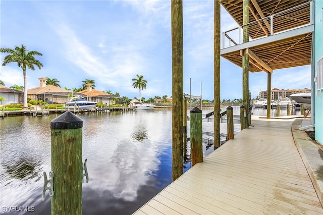 dock area with a water view