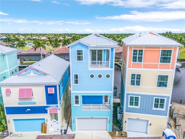 view of front of home featuring a balcony and a garage