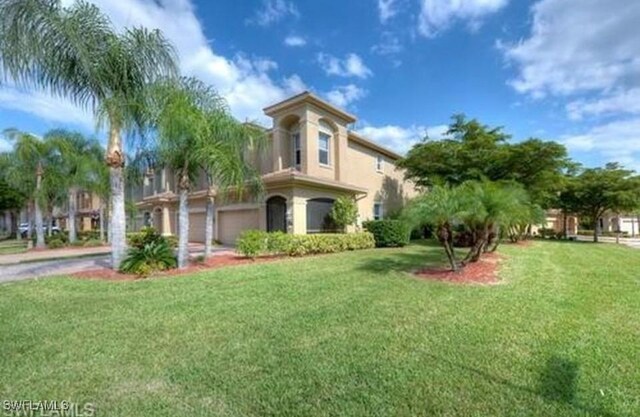 view of side of home with a yard