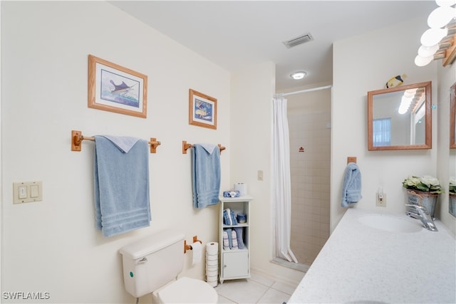 bathroom featuring vanity, tile patterned flooring, toilet, and walk in shower