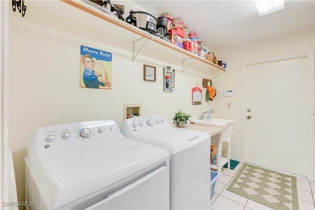 laundry area featuring independent washer and dryer and light tile patterned floors