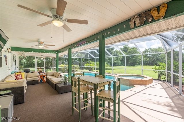 sunroom with a pool and ceiling fan