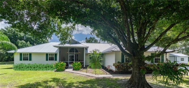 ranch-style home with a front lawn