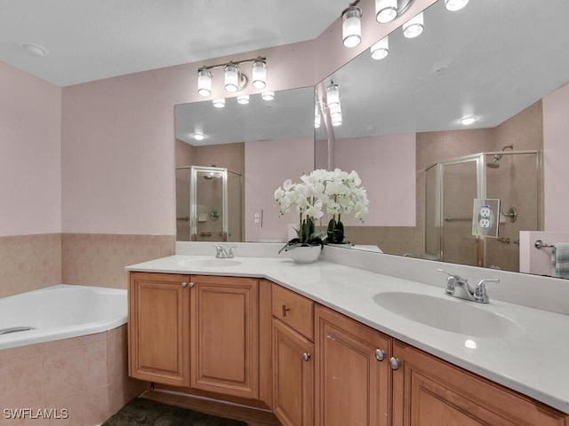 bathroom featuring vanity and plus walk in shower