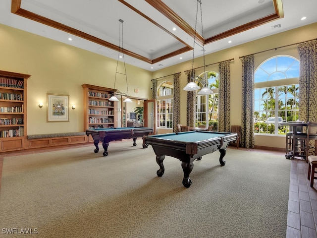 recreation room featuring dark colored carpet, a raised ceiling, a towering ceiling, and billiards