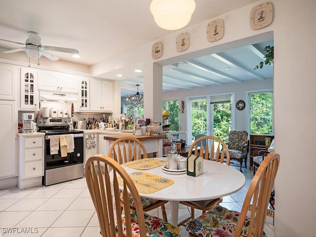 dining room featuring beam ceiling, ceiling fan, and light tile patterned floors