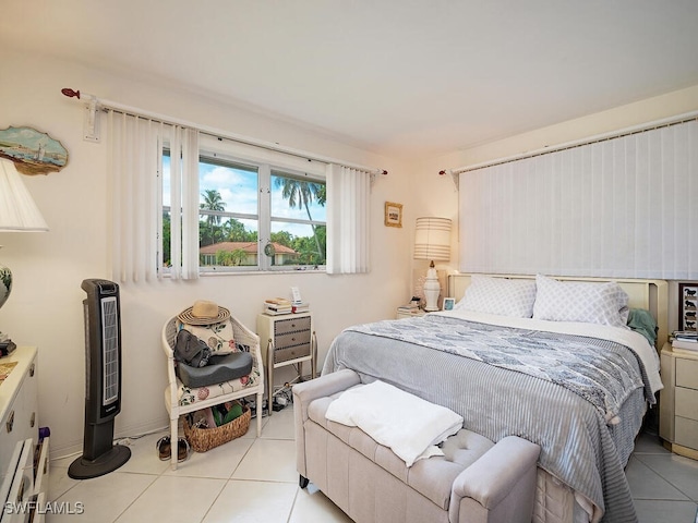 bedroom with light tile patterned floors