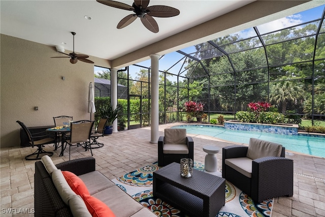 view of patio / terrace with ceiling fan, a lanai, and pool water feature