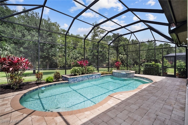 view of pool featuring a patio, a lanai, and an in ground hot tub