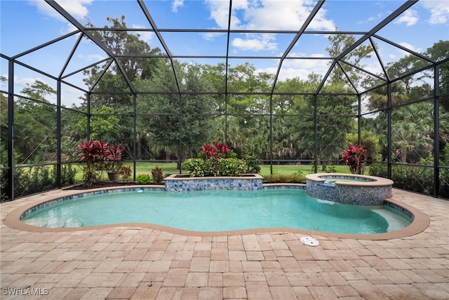 view of pool with a patio, a lanai, and an in ground hot tub