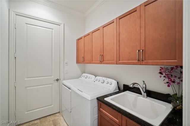 laundry room with cabinets, sink, separate washer and dryer, and crown molding