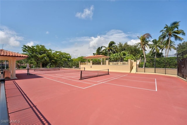 view of sport court featuring community basketball court and fence