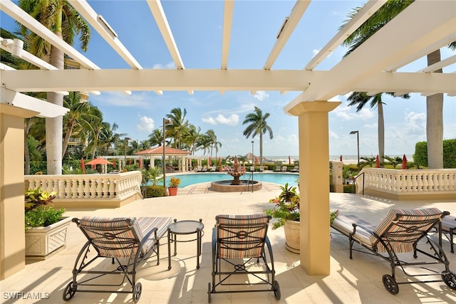 view of patio / terrace with a pergola and a community pool